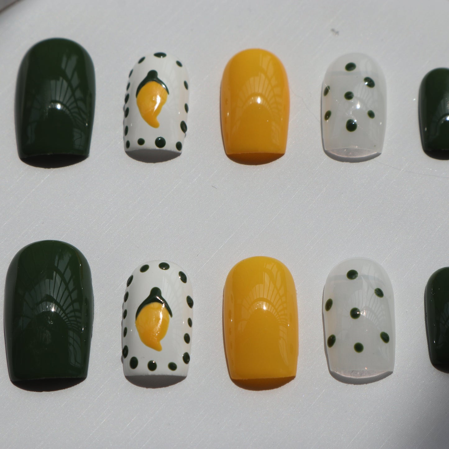 Designer: XinXin 10. Mango yellow green handmade nails